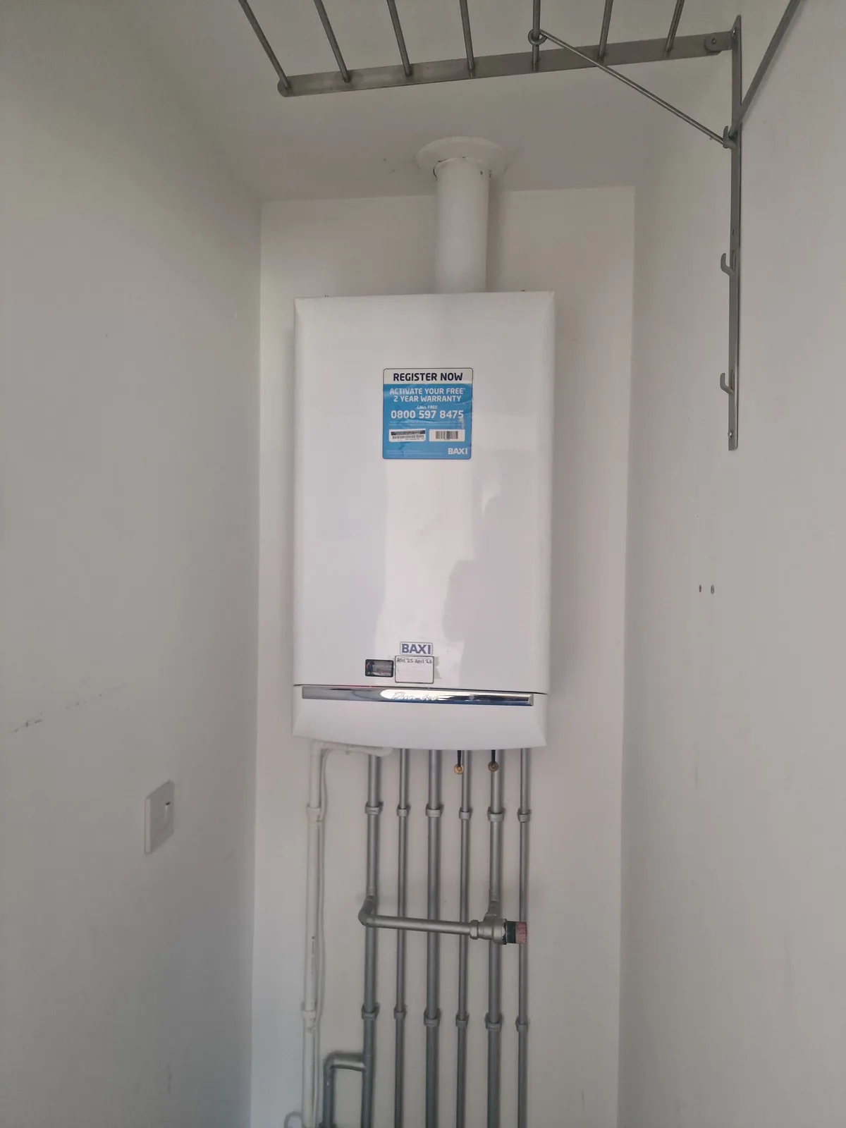 The original Baxi combi boiler before replacement, showing the failed unit