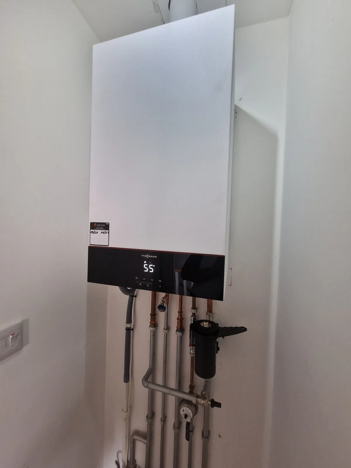 New Viessmann Vitodens combi boiler installed by Fireflow with tidy copper pipework and system filter