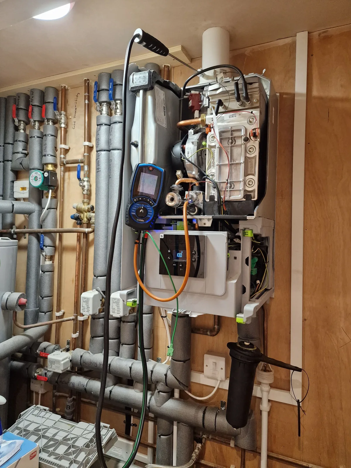 Boiler internals exposed with combustion readings taken on a digital analyser